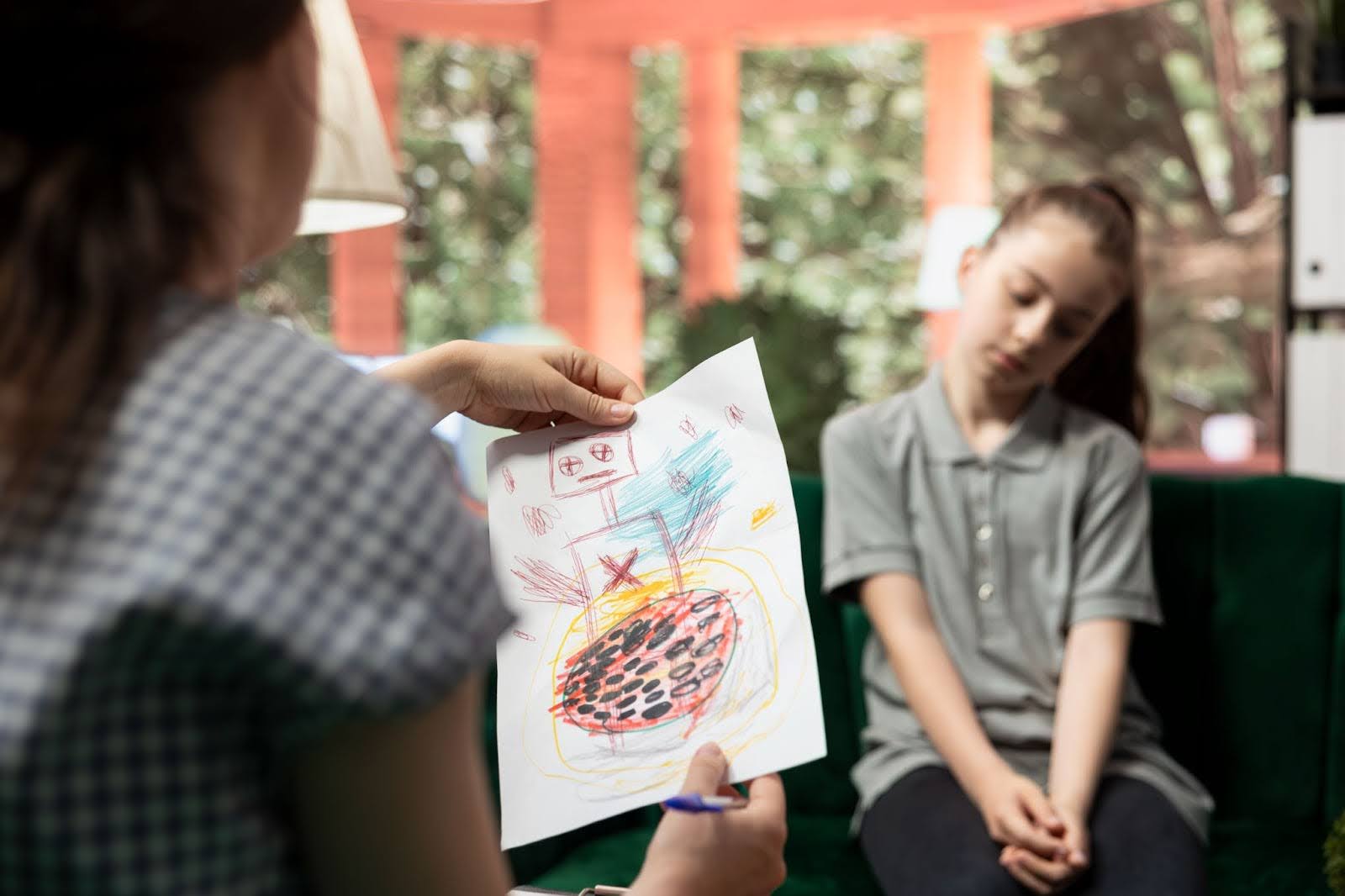 A teenager presents an unsettling sketch during counseling for ADHD